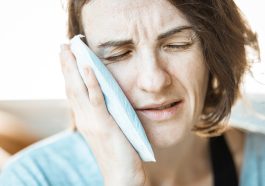 Girl, ice pack, toothache — "Aptamil 1: The Perfect Start to Your Baby’s Formula Journey"