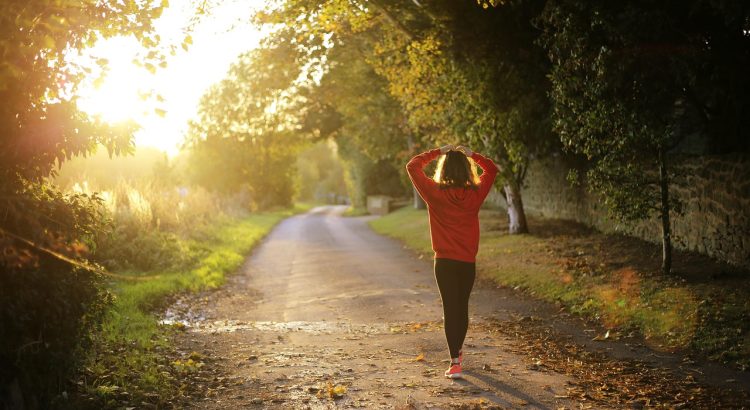 Walking, fitness, girl — Comparing traditional and modern hair loss treatment in Singapore- Embracing Nature's Solution