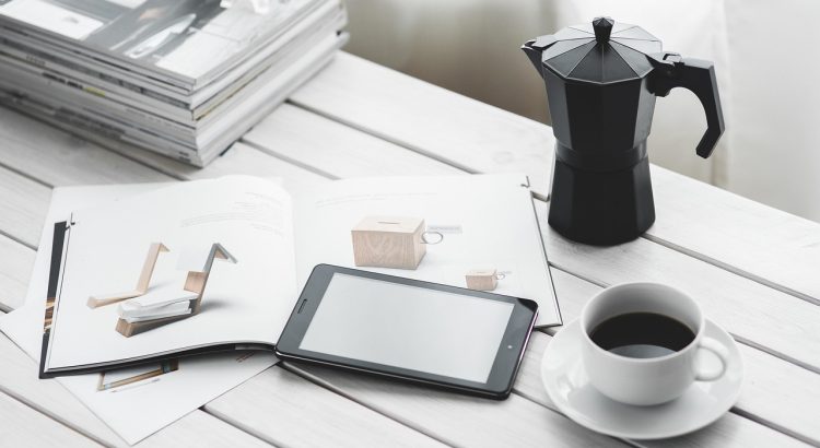 Technology, tablet, coffee cup — How Forex Markets Impact the Global Economy
