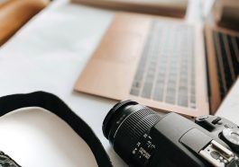 Laptop, camera, desk — White Label SEO: A Scalable Solution for Small Agencies